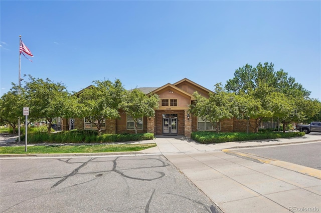 17442 Nature Walk Trl Unit 107, Parker, CO 80134 - obstructed view of property featuring french doors and brick siding