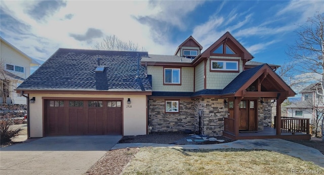 view of front of home with concrete driveway and an attached garage