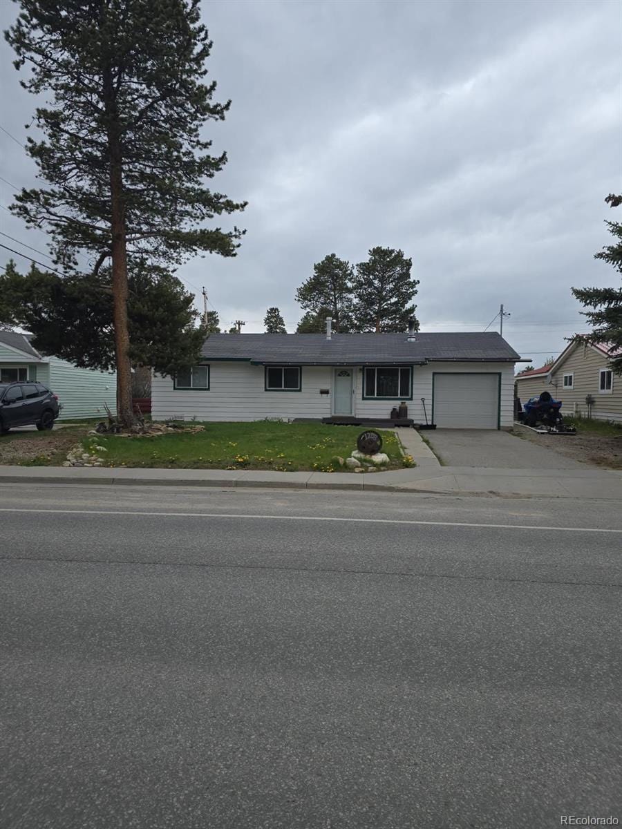 1208 Mount Massive Dr, Leadville, CO 80461 - ranch-style house featuring an attached garage and concrete driveway