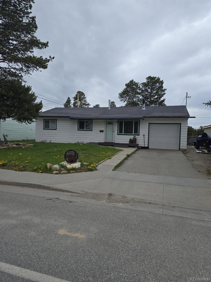 1208 Mount Massive Dr, Leadville, CO 80461 - single story home with a garage, driveway, and a front yard