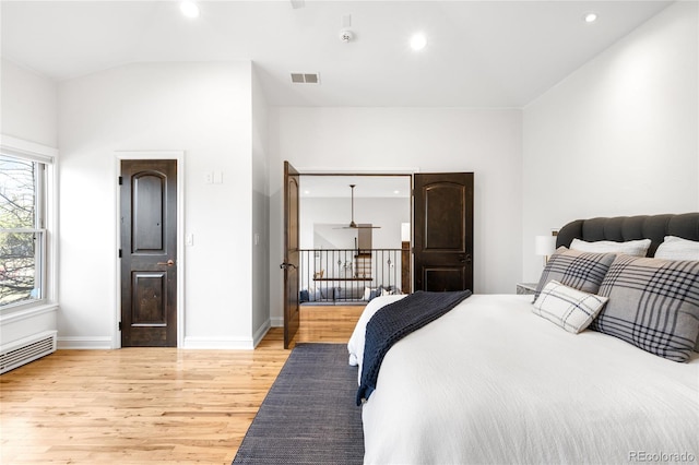 bedroom with baseboards, light wood-style flooring, visible vents, and recessed lighting