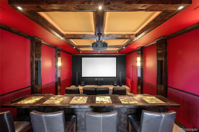 cinema with crown molding and coffered ceiling