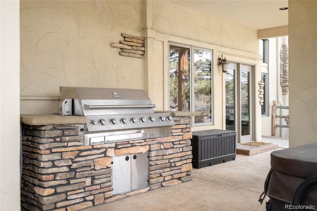 view of patio / terrace featuring an outdoor kitchen and area for grilling