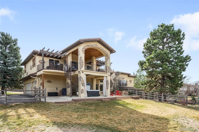 rear view of property with stairway, a fenced backyard, cooling unit, and stucco siding