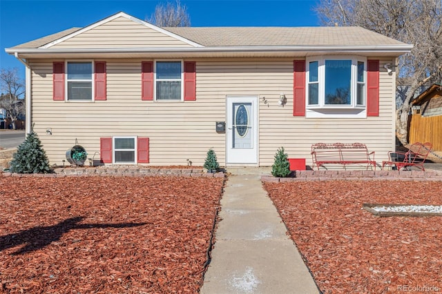 split foyer home with roof with shingles