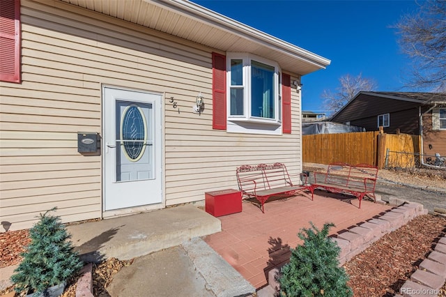 doorway to property with fence