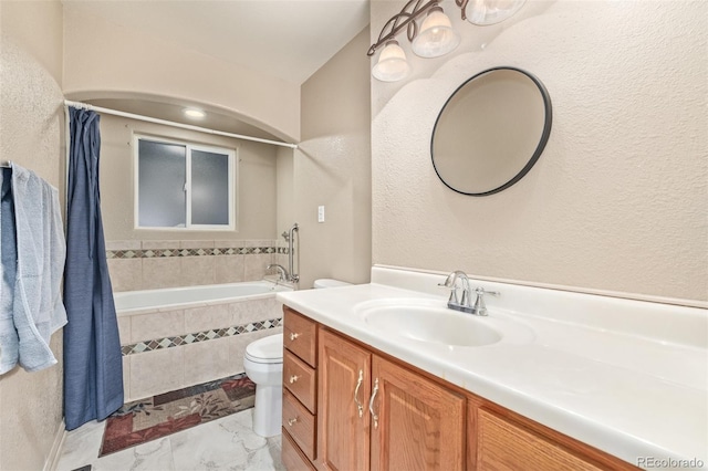 bathroom with toilet, vanity, marble finish floor, a shower with curtain, and tiled tub