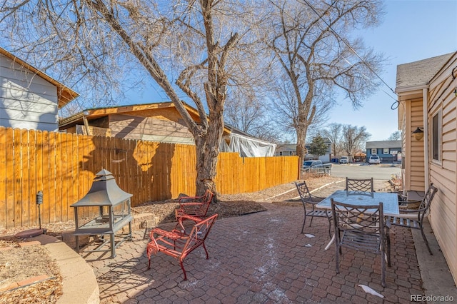 view of patio / terrace with outdoor dining area and fence