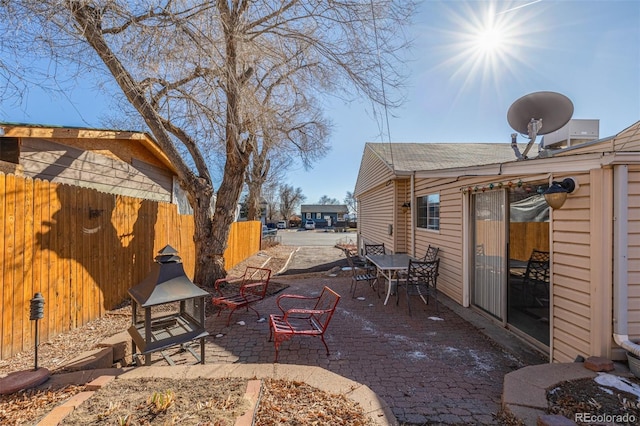 view of patio featuring fence