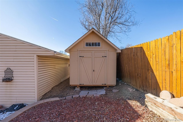 view of shed featuring a fenced backyard