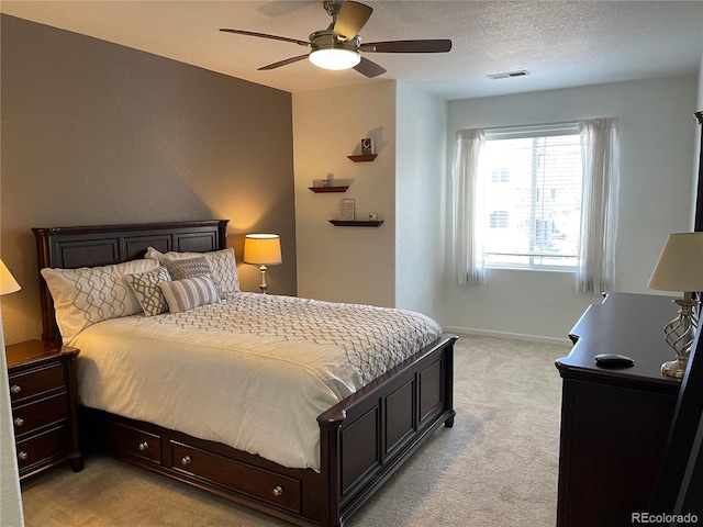 9557 W San Juan Cir Unit 207, Littleton, CO 80128 - bedroom with light colored carpet, baseboards, and ceiling fan