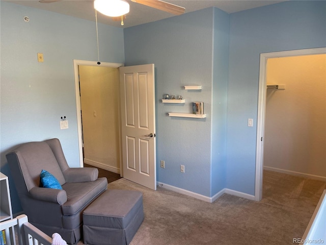 9557 W San Juan Cir Unit 207, Littleton, CO 80128 - sitting room with ceiling fan, carpet floors, and baseboards