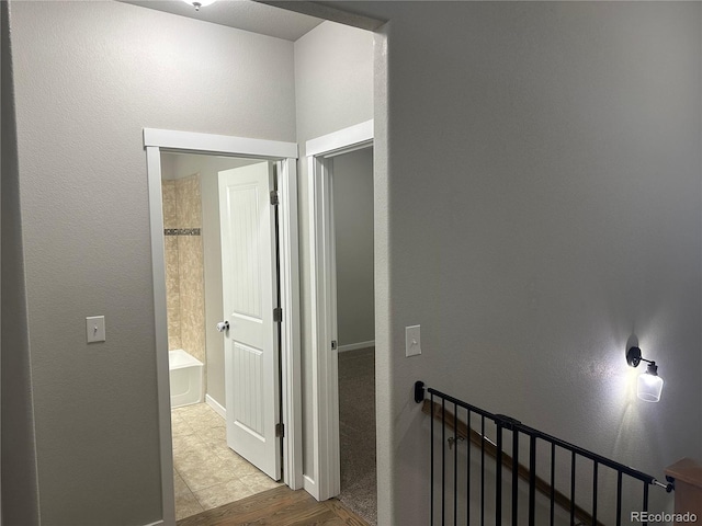 hallway featuring light tile patterned flooring