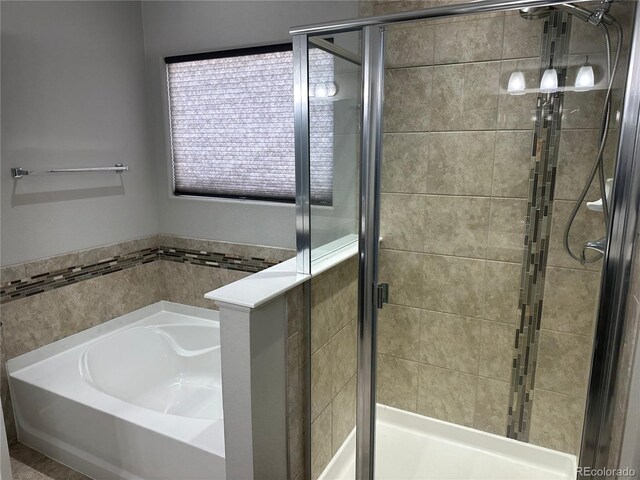 bathroom featuring plus walk in shower