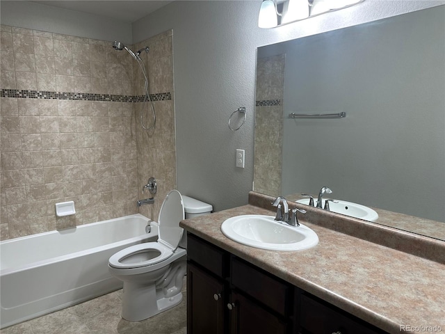 full bathroom with tiled shower / bath combo, vanity, and toilet