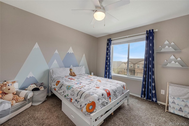 carpeted bedroom with baseboards and ceiling fan