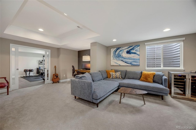 living room featuring beverage cooler, recessed lighting, carpet, and baseboards