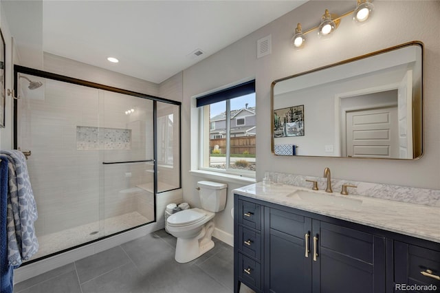 full bath with vanity, tile patterned flooring, visible vents, toilet, and a stall shower