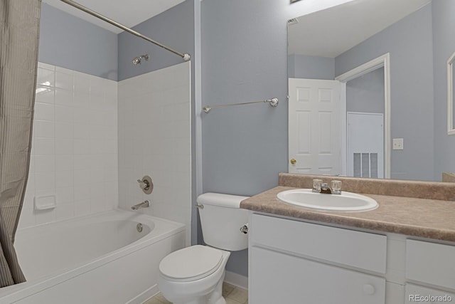 full bath featuring shower / bath combination, vanity, toilet, and tile patterned floors