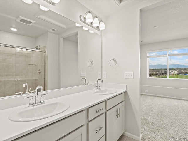 bathroom featuring walk in shower and vanity