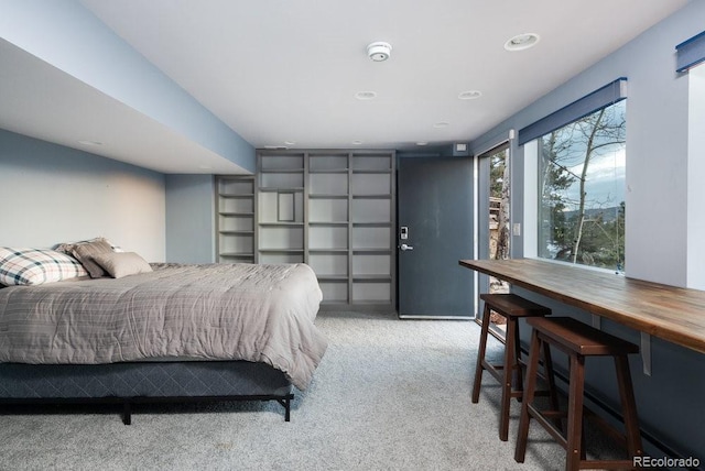 bedroom with light colored carpet