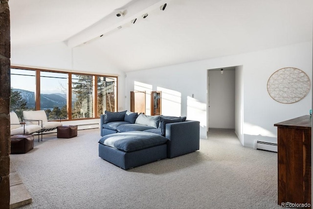 living room with a baseboard radiator, beam ceiling, a mountain view, and carpet floors