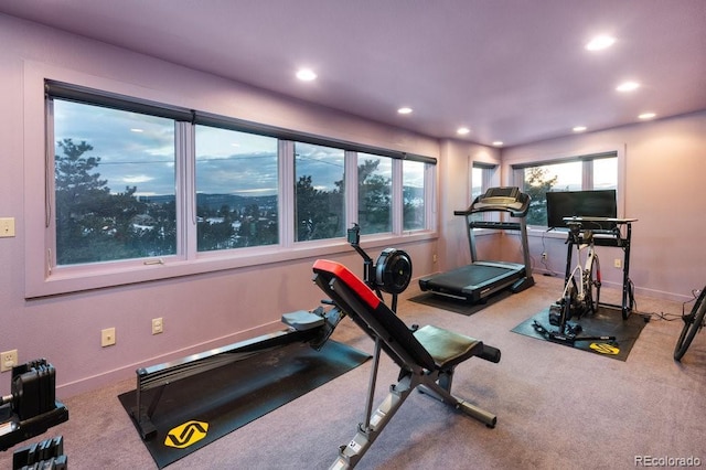 exercise area featuring carpet floors, baseboards, and recessed lighting