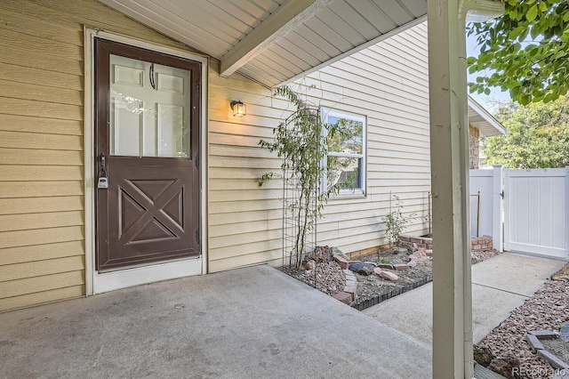 entrance to property featuring a gate and fence