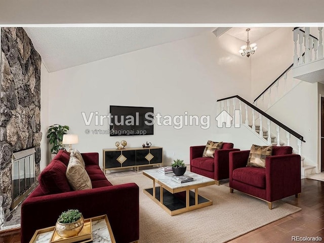 living room with beam ceiling, wood-type flooring, high vaulted ceiling, a notable chandelier, and a fireplace