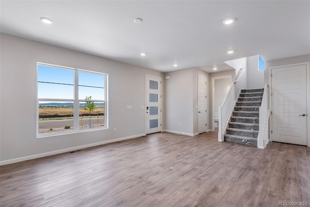 unfurnished living room featuring light wood-type flooring