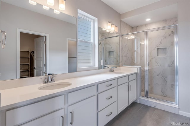 bathroom featuring vanity and an enclosed shower