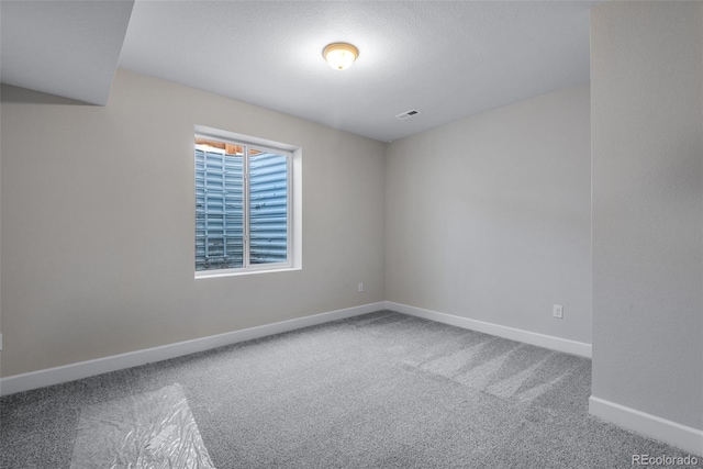 view of carpeted spare room