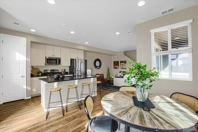 dining space featuring light hardwood / wood-style flooring