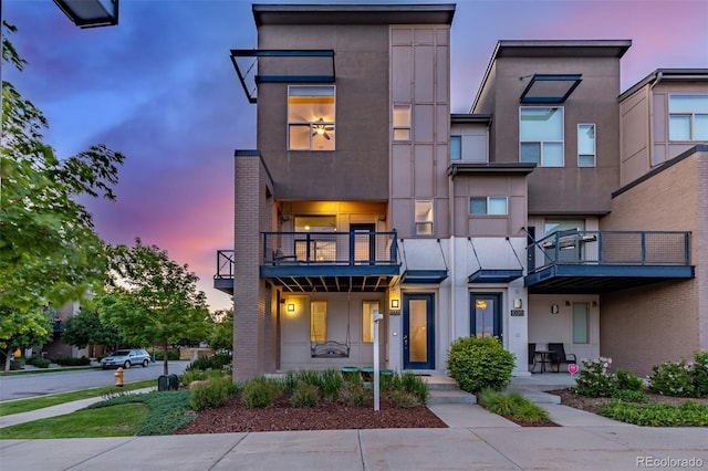 10305 Martin Luther King Blvd, Denver, CO 80238 - view of front of house with a balcony and stucco siding
