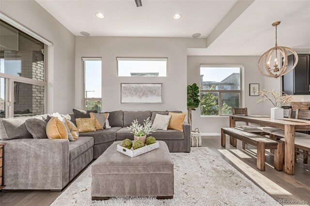 10305 Martin Luther King Blvd, Denver, CO 80238 - living area featuring a chandelier, wood finished floors, recessed lighting, and baseboards