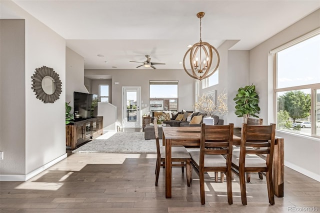 10305 Martin Luther King Blvd, Denver, CO 80238 - dining space featuring wood-type flooring, a chandelier, ceiling fan, and baseboards
