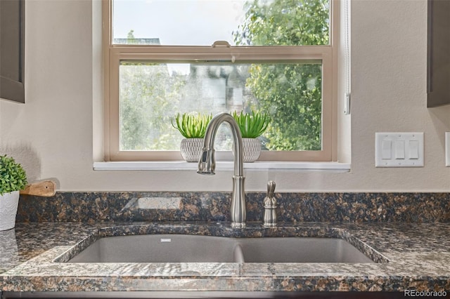 10305 Martin Luther King Blvd, Denver, CO 80238 - kitchen view of a sink and dark stone counters