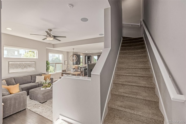 10305 Martin Luther King Blvd, Denver, CO 80238 - staircase with a ceiling fan, wood finished floors, and recessed lighting