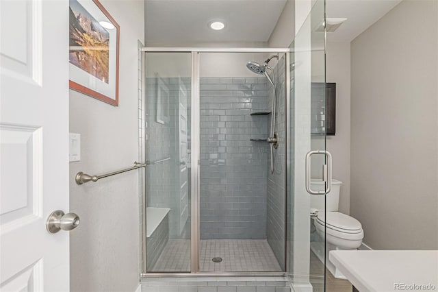 10305 Martin Luther King Blvd, Denver, CO 80238 - full bathroom featuring a shower stall, toilet, recessed lighting, and tile patterned flooring