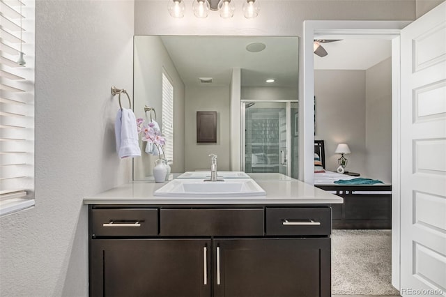 10305 Martin Luther King Blvd, Denver, CO 80238 - full bathroom with connected bathroom, a shower stall, vanity, and a textured wall