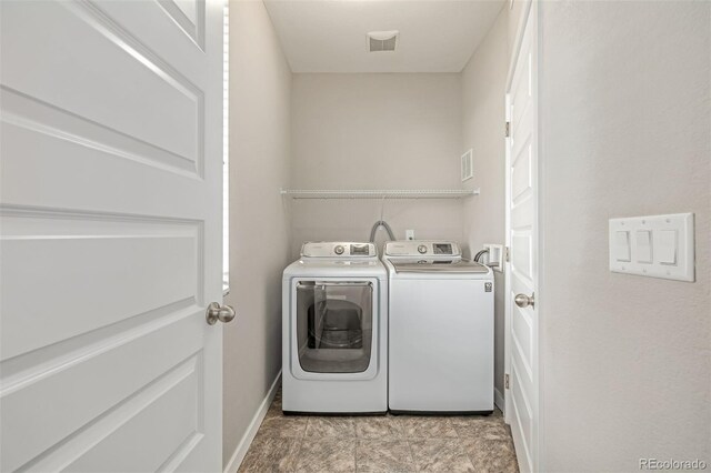 10305 Martin Luther King Blvd, Denver, CO 80238 - laundry room with washer and clothes dryer and baseboards