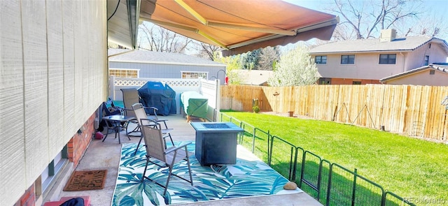 8561 E Grand Ave, Denver, CO 80237 - view of patio with grilling area, a fenced backyard, and an outdoor fire pit