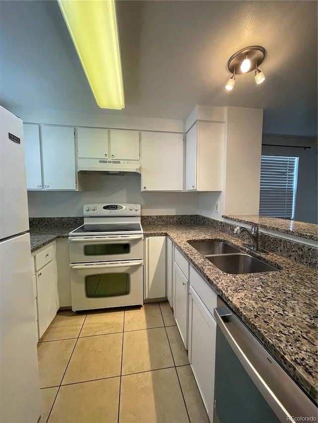 16485 E 17th Pl Unit D, Aurora, CO 80011 - kitchen featuring white appliances, light tile patterned flooring, under cabinet range hood, and white cabinets