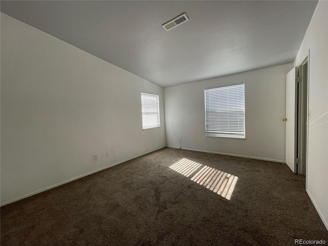 16485 E 17th Pl Unit D, Aurora, CO 80011 - spare room featuring carpet flooring and vaulted ceiling