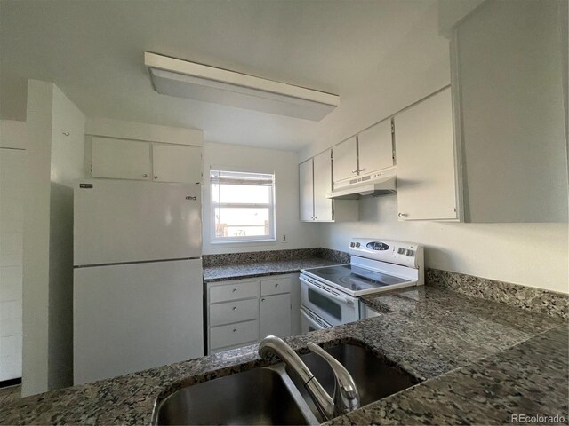 16485 E 17th Pl Unit D, Aurora, CO 80011 - kitchen with white appliances, under cabinet range hood, white cabinets, and dark stone countertops