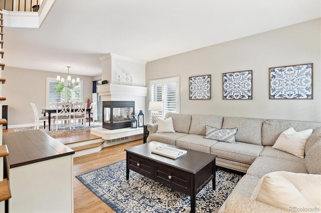 1449 Braewood Ave, Highlands Ranch, CO 80129 - living room featuring wood finished floors and a chandelier