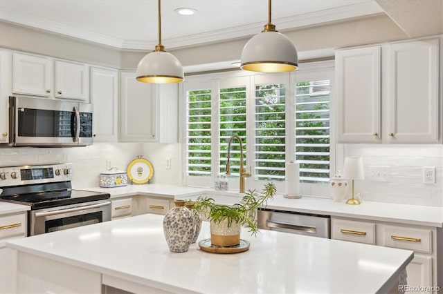 1449 Braewood Ave, Highlands Ranch, CO 80129 - kitchen with stainless steel appliances, light countertops, white cabinetry, ornamental molding, and tasteful backsplash