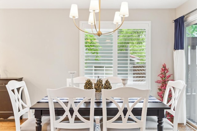 1449 Braewood Ave, Highlands Ranch, CO 80129 - dining room with a chandelier and wood finished floors
