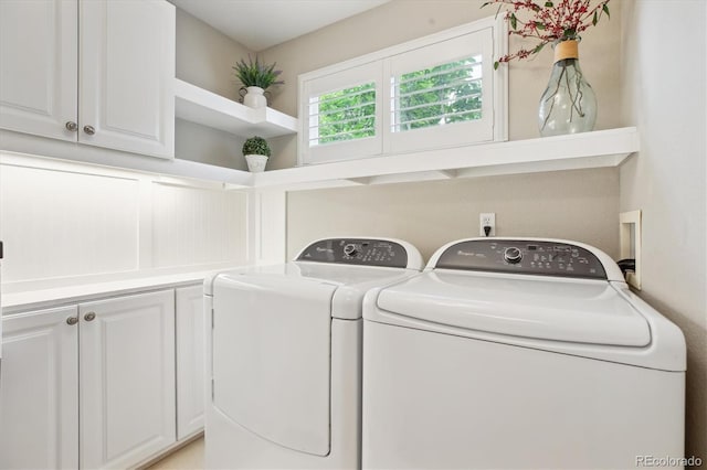 1449 Braewood Ave, Highlands Ranch, CO 80129 - laundry area featuring separate washer and dryer and cabinet space