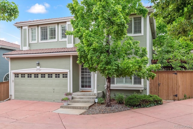 1449 Braewood Ave, Highlands Ranch, CO 80129 - view of front of home with an attached garage, a tile roof, and driveway